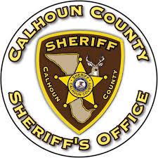 Calhoun County Sheriff's Office logo featuring a gold star and deer on a brown and yellow badge.
